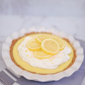 yellow and white cupcake on white and blue checkered textile