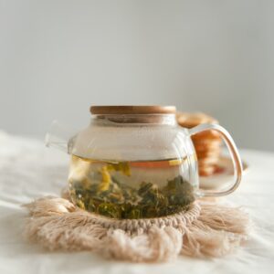 clear glass jar on white textile