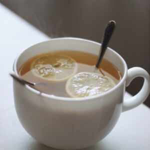 white ceramic mug with yellow liquid